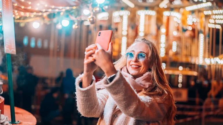 Woman takes selfie as New Recording-Enabled Gaming Salon