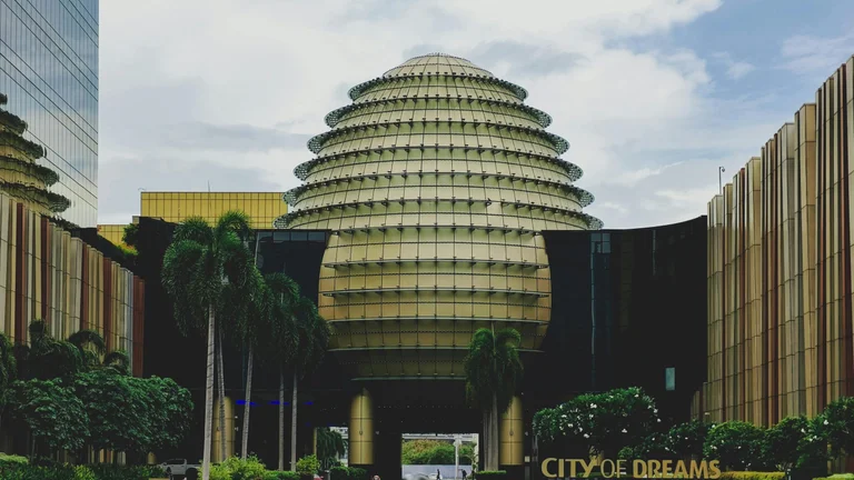 City of Dreams, Manila dome with asset divestment