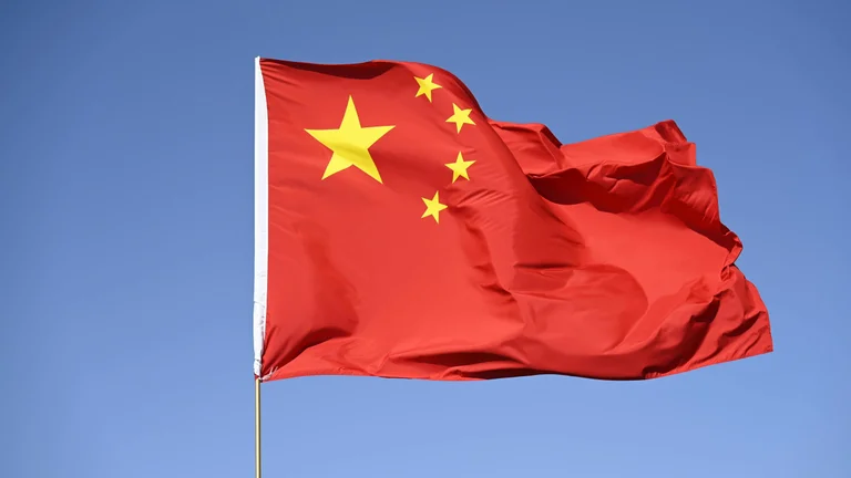 Chinese flag in the wind as its Singapore embassy signals gaming risks