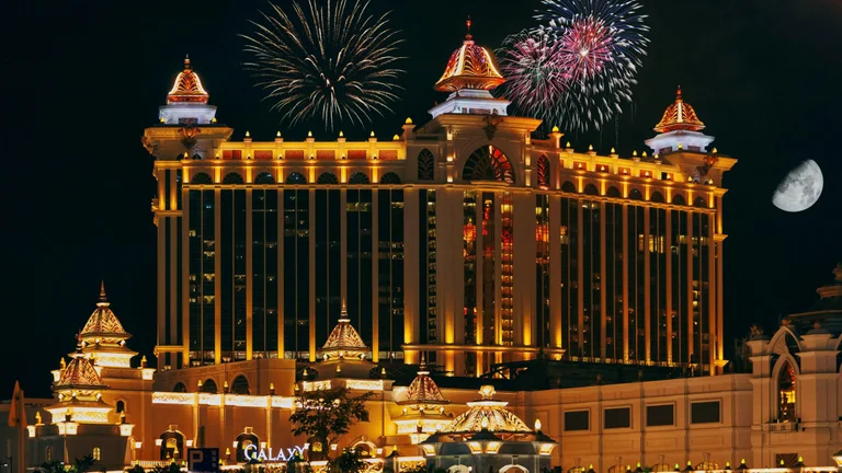 Macau at night, as their Gross Gaming Revenue Forecast is deemed too conservative