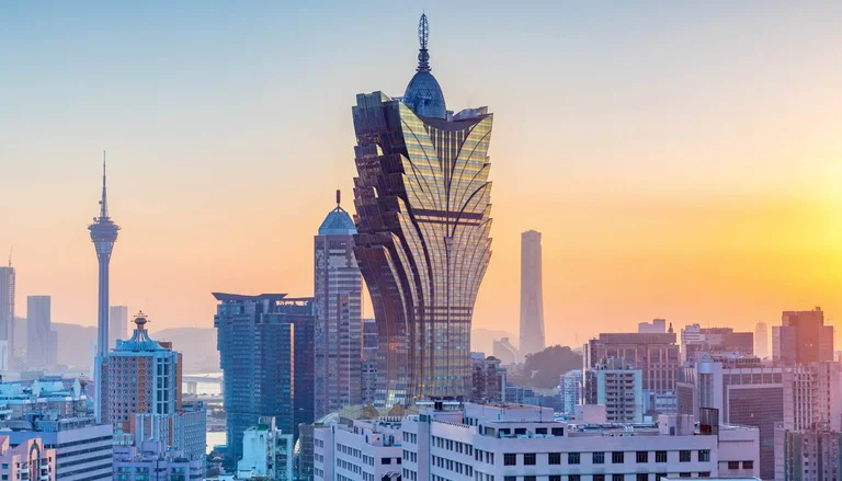 Macau GGR growth 2026 - Grand Lisboa and city skyline at sunset