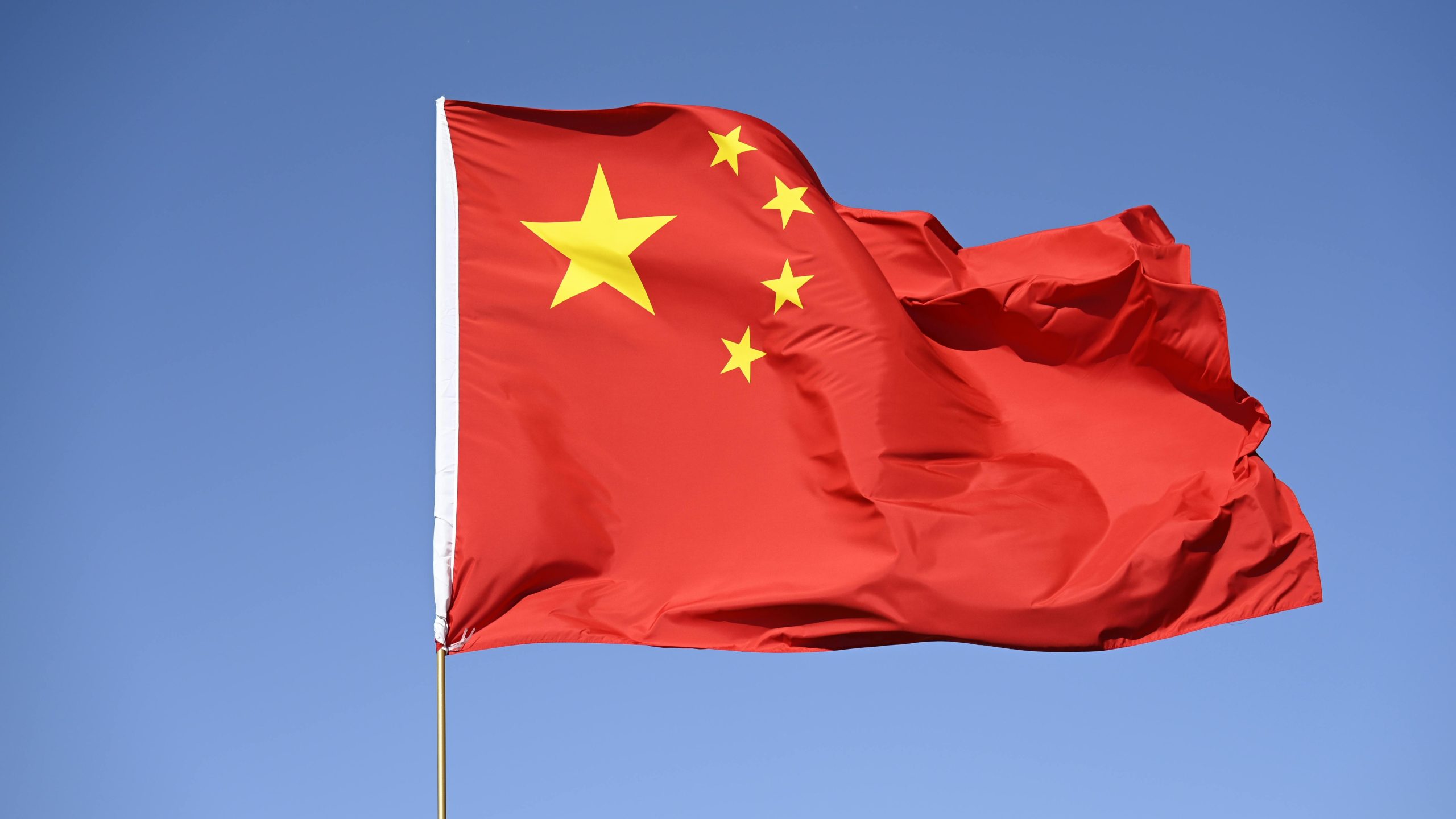 Chinese flag in the wind as its Singapore embassy signals gaming risks